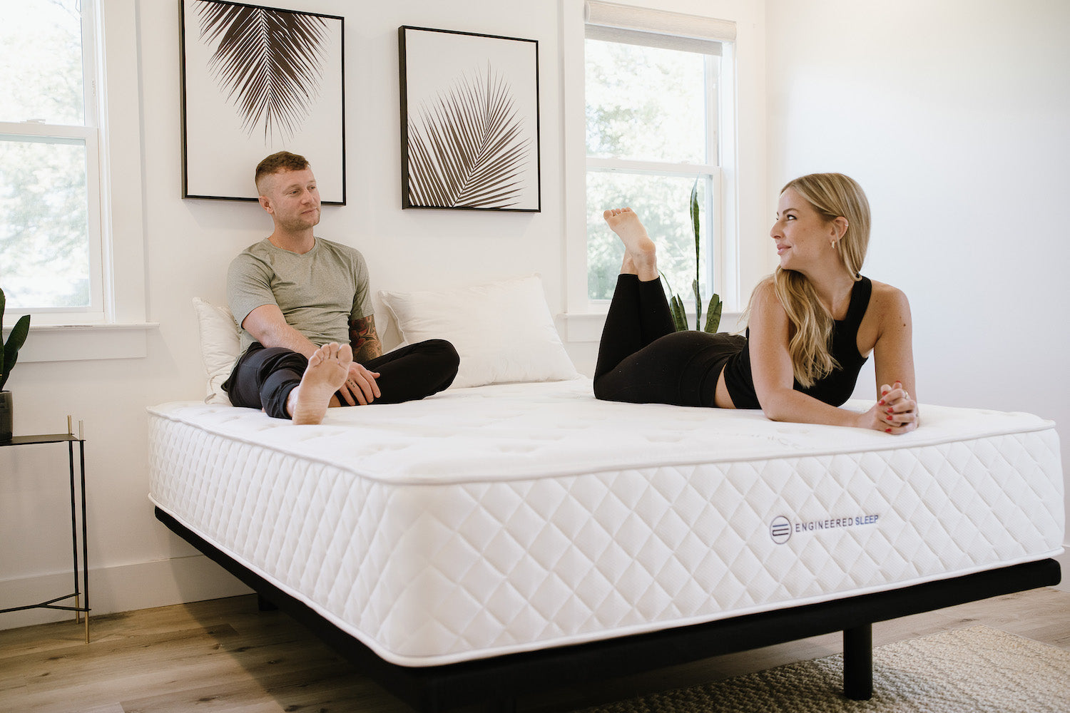 Classic Hybrid 12" Ultra-Firm with a couple laying on it.