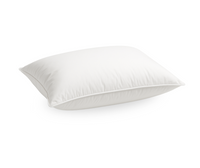 Fluffy white ES Cozy Down Pillow with a soft, medium feel and subtle piping.