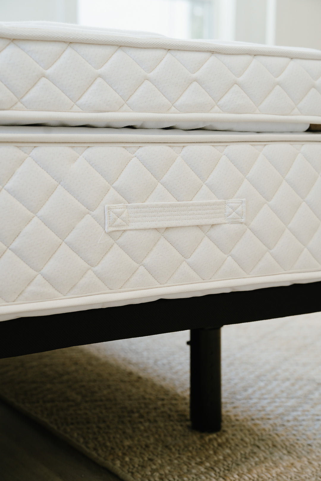 an image of our mattress handles. These tufted handles are very strong for flipping and turning your mattress.