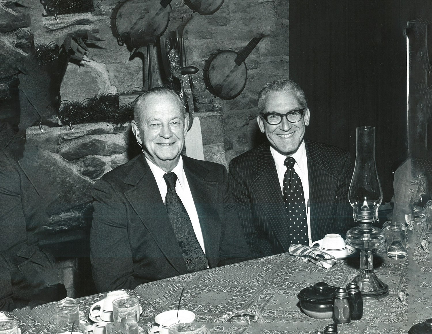 smiling men at an awards dinner