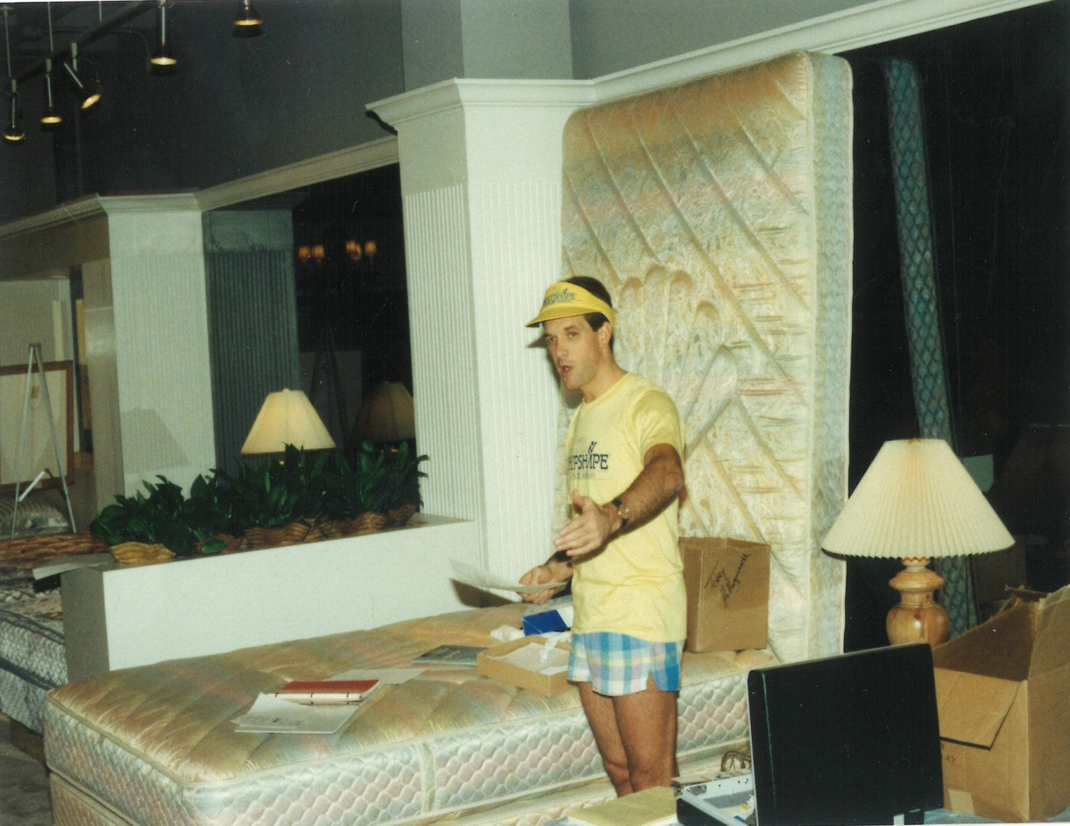 vintage photo of a man selling mattresses