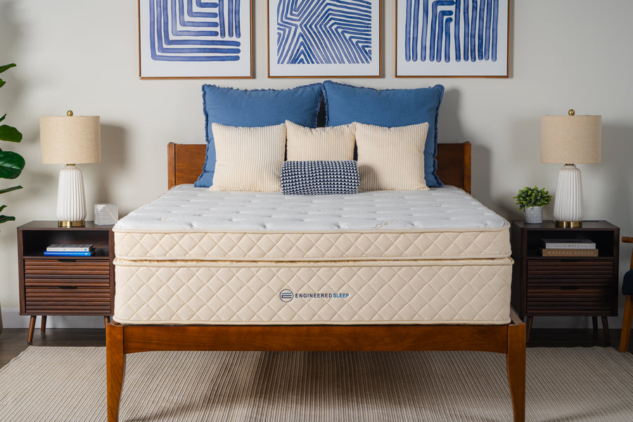 Cream Duo Latex Mattress with quilted top and bottom layers on a wooden bed frame.