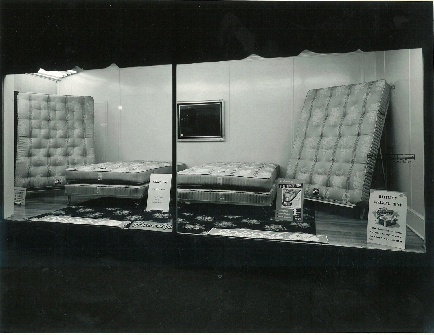 vintage photo of a mattress store window display