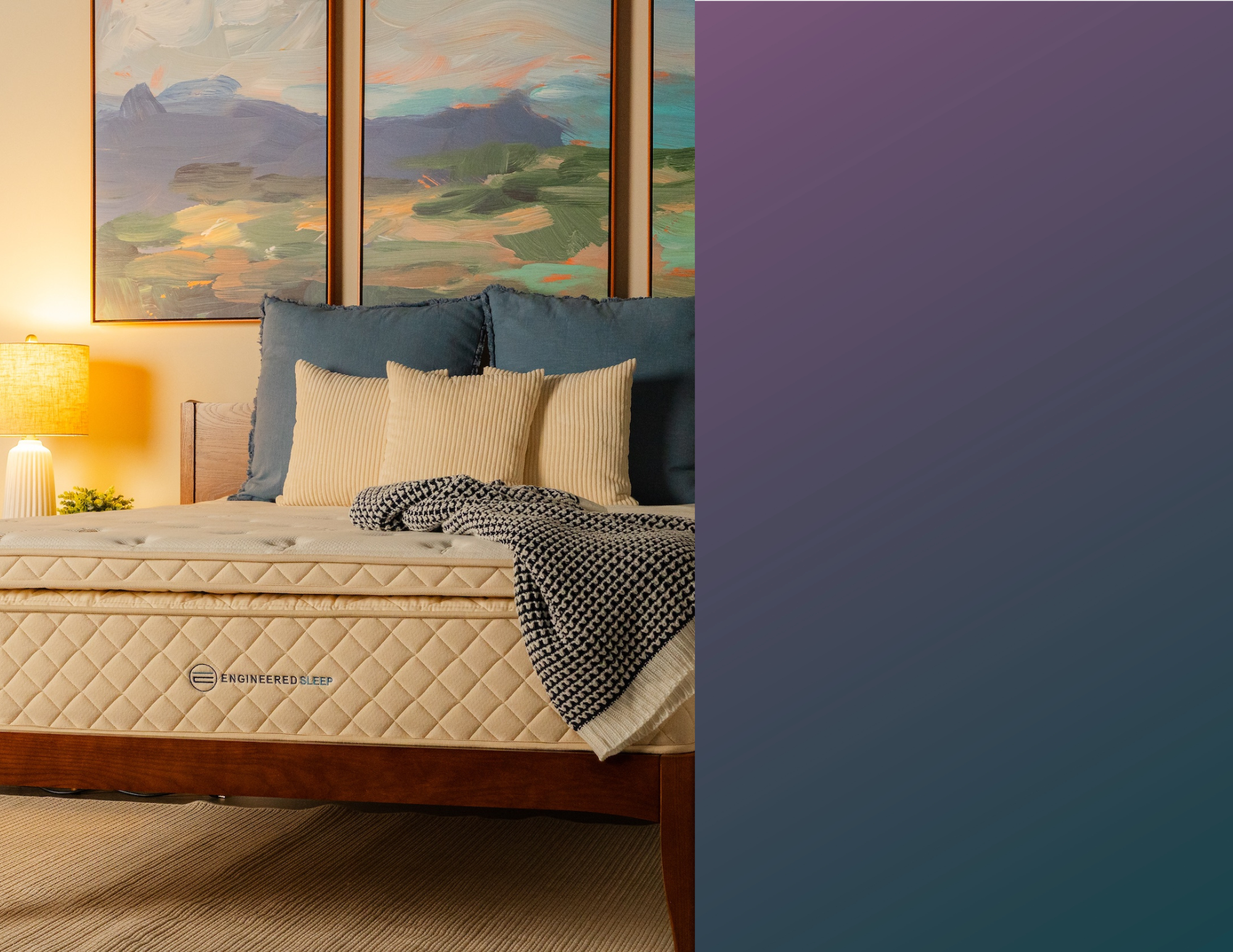 Bed with pillows and a blanket in a bedroom setting, featuring a purple accent wall.