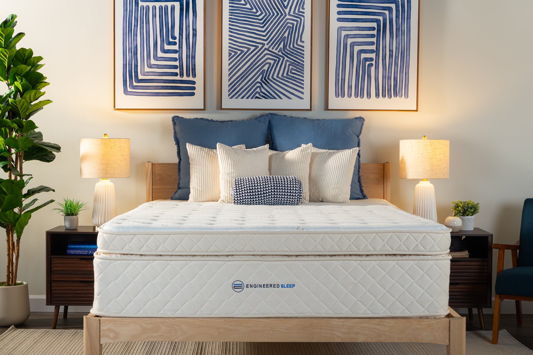 Mattress on a bed in a bedroom with decorative pillows and lamps.