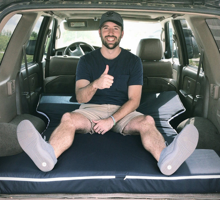 OOn-The-Go SUV Mattress in a car with a man by Engineered Sleep
